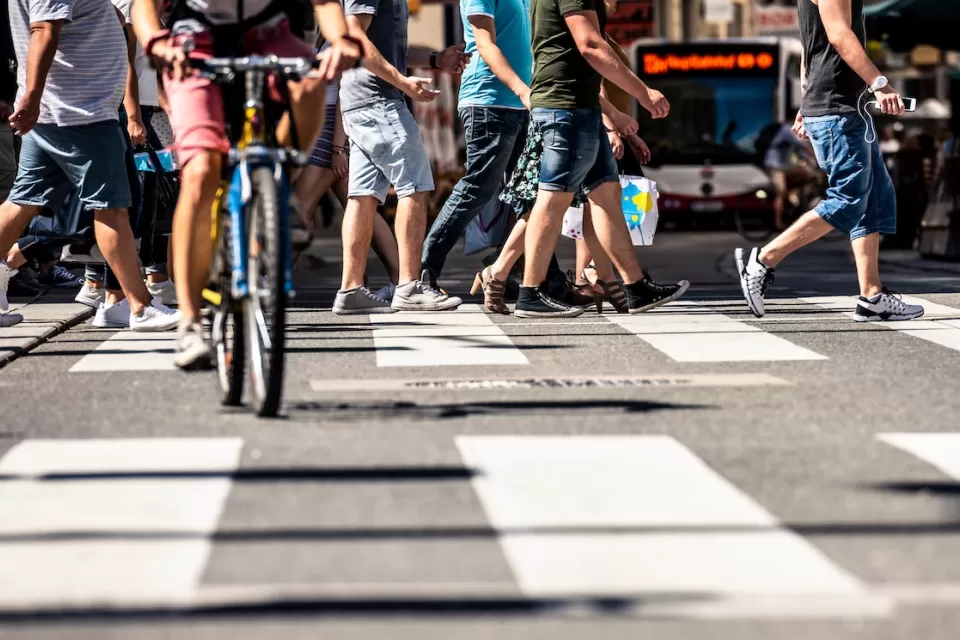 Low close-up of busy city crosswalk in Vienna, Austria.